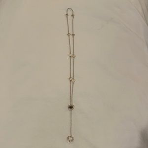 Authentic retired Tiffany & Co. sterling silver heart lariat necklace.